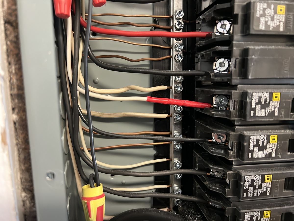 Breakers, wire sizes and connections inside the panel.