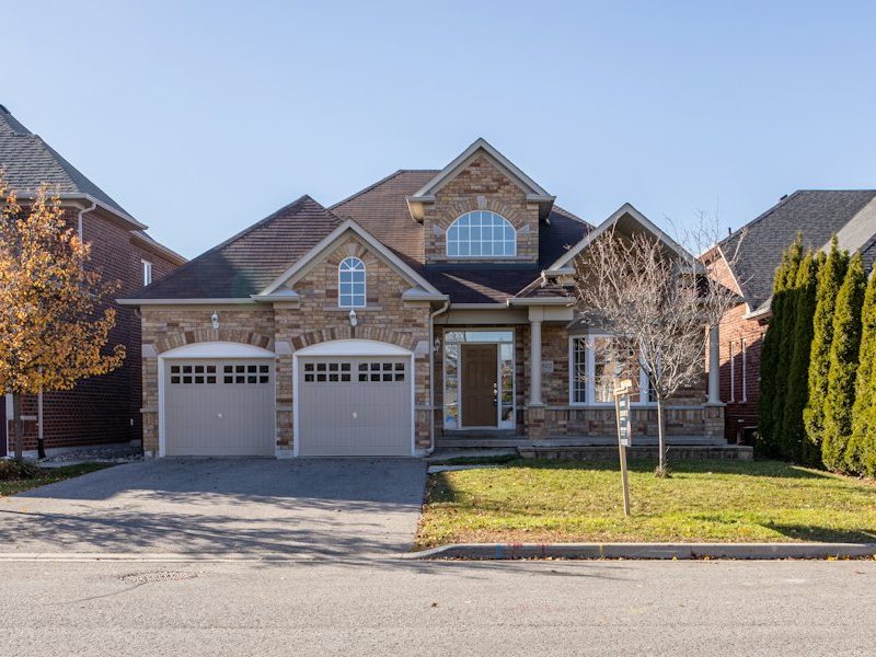 Brick two-story home with a complex roofline